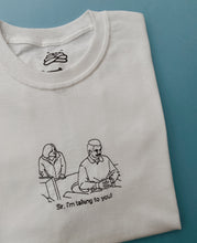 Load image into Gallery viewer, embroidered ron swanson circular desk 'parks and recreation' scene t-shirt