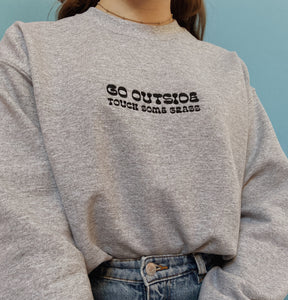 embroidered 'go outside' crew neck jumper