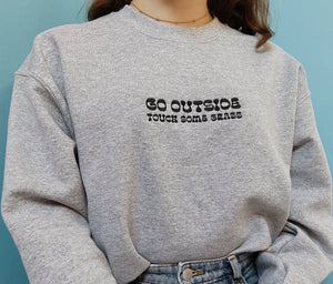 embroidered 'go outside' crew neck jumper