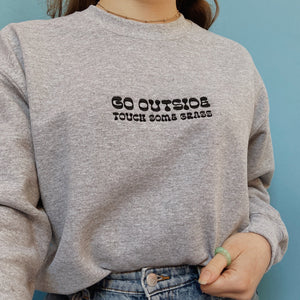 embroidered 'go outside' crew neck jumper