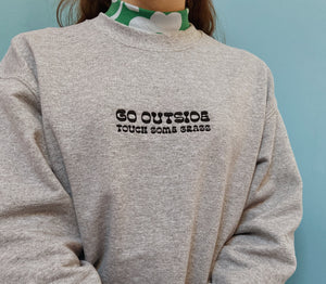 embroidered 'go outside' crew neck jumper