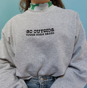 embroidered 'go outside' crew neck jumper