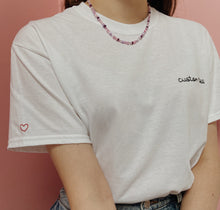 Load image into Gallery viewer, personalised hand embroidered t-shirt with heart sleeve embroidery
