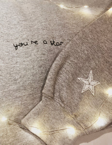 hand embroidered 'you're a star' sweatshirt with sleeve detail