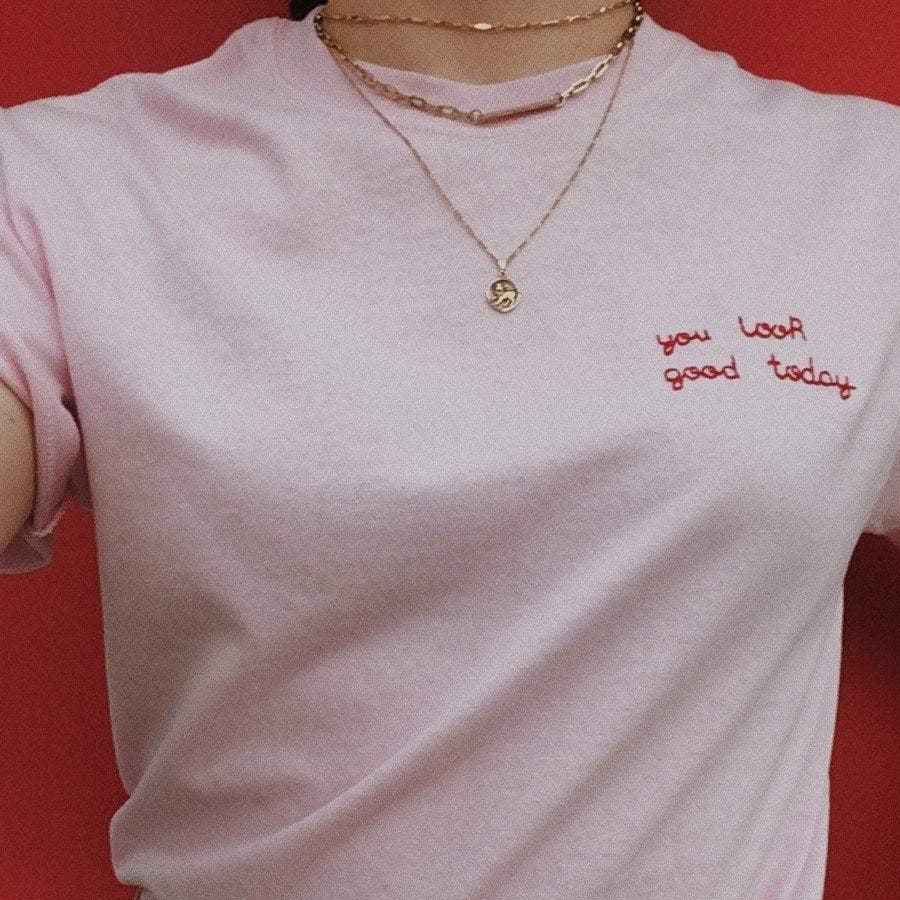 light pink hand embroidered 'you look good today' t-shirt